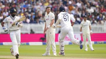 Ollie Robinson watches the fielders after bowling during the fifth day of Lord's Test