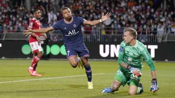 PSG's Kylian Mbappe, left, celebrates after scoring his side's second goal during a French League One soccer match between Brest and PSG at the Francis-Le Ble stadium in Brest, France, Friday, Aug. 20