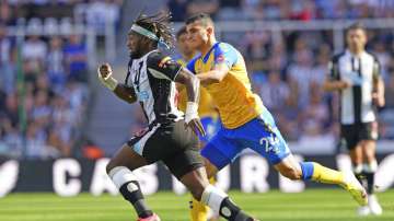Newcastle United's Allan Saint-Maximin, left, and Southampton's Mohamed Elyounoussi 