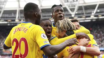 Crystal Palace's Conor Gallagher, right, celebrates with teammates after scoring during the English Premier League soccer match between West Ham United and Crystal Palace at the London Stadium, London, Saturday, Aug. 28