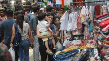 FILE | People visit a crowded market as the authorities allowed to open the market on Saturdays amid Covid-19 lockdown in Noida