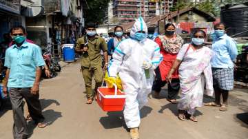 A health worker during a door-to-door screening in the wake of COVID-19, at Dharavi in Mumbai.