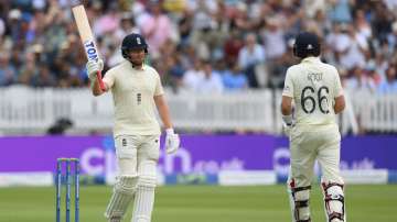 Jonny Bairstow of England celebrates with Joe Root after reaching 50 during the Second LV= Insurance Test Match: Day Three between England and India at Lord's Cricket Ground on August 14