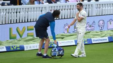 England bowler Mark Wood injures his shoulder after attempting to save a boundary during day four of the Second Test Match between England and India at Lord's Cricket Ground on August 15
