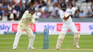 Ajinkya Rahane of India bats watched by England wicketkeeper Jos Buttler during day four of the Second LV= Insurance Test Match between England and India at Lord's Cricket Ground on August 15