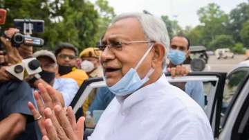 Bihar Chief Minister Nitish Kumar speaks to media outside Raj Bhawan after meeting the state governor, in Patna.