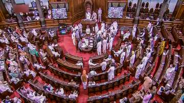 Opposition MPs shout slogans demanding a discussion on Pegasus Project report in Rajya Sabha during the Monsoon Session of Parliament.