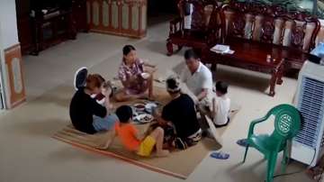 As family of six eats dinner, ceiling fan falls right in their midst. See spine chilling video