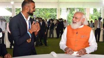 PM Narendra Modi with Indian men's hockey team goalkeeper PR Sreejesh