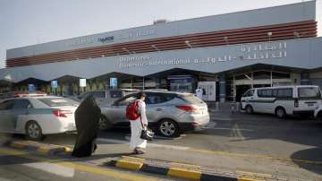 FILE - In this Aug. 22, 2019 file photo, Saudi passengers enter the departure terminal of Abha airport, in southwestern Saudi Arabia.