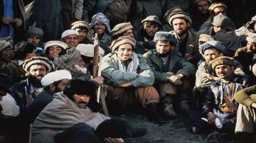 In this 1984 file photo, Afghan guerrilla leader, Ahmad Shah Massoud, center, is surrounded by Mujahideen commanders at a meeting of the rebels in the Panjshir Valley in northeast Afghanistan.