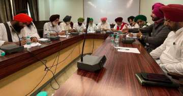 Farmer leaders speaking to Congress leader Navjot Singh Sidhu during a meeting in Chandigarh on Friday