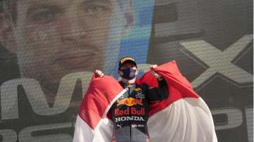 Red Bull driver Max Verstappen of the Netherlands celebrates on the podium after winning the Formula One Dutch Grand Prix, at the Zandvoort racetrack, Netherlands, Sunday, Sept. 5