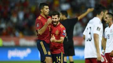 Spain's Jose Gaya, 2nd left, celebrates after scoring his side's opening goal during the World Cup 2022 group B qualifying soccer match between Spain and Georgia at the Nuevo Estadio Vivero in Badajoz, Spain, Sunday, Sept. 5