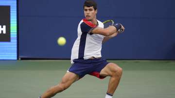 Carlos Alcaraz, of Spain, returns against Peter Gojowczyk, of Germany, during the fourth round of the U.S. Open tennis championships, Sunday, Sept. 5