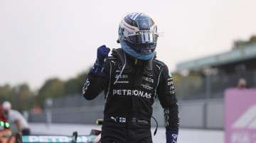 Mercedes driver Valtteri Bottas of Finland reacts after he clocked the fastest time during the qualifying session at the Monza racetrack, in Monza, Italy , Friday, Sept.10, 2021. The Formula one race will be held on Sunday