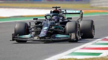 Mercedes driver Lewis Hamilton of Britain steers his car during a free practice at the Monza racetrack, in Monza, Italy , Saturday, Sept.11
