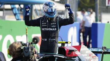Mercedes driver Valtteri Bottas of Finland celebrates winning the Sprint Race qualifying session at the Monza racetrack, in Monza, Italy , Saturday, Sept.11