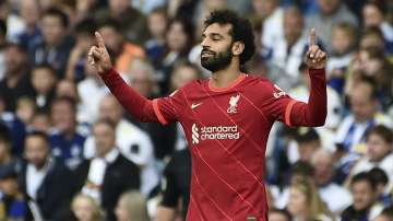 Liverpool's Mohamed Salah celebrates after scoring the opening goal during the English Premier League soccer match between Leeds United and Liverpool at Elland Road, Leeds, England, Sunday, Sept. 12