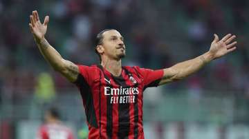 Milan's Zlatan Ibrahimovic celebrates after scoring his side's seconf goal during the Italian Serie A soccer match between Milan and Lazio at the San Siro stadium in Milan, Italy, Sunday, Sept. 12