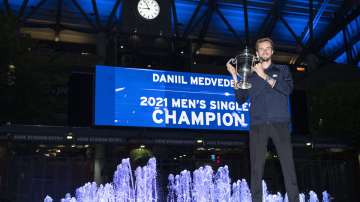Daniil Medvedev, of Russia, holds up the championship trophy after defeating Novak Djokovic, of Serbia, in the men's singles final of the US Open tennis championships, Sunday, Sept. 12, 2021