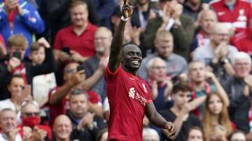 Liverpool's Sadio Mane celebrates after scoring the opening goal during the English Premier League soccer match between Liverpool and Crystal Palace at Anfield Stadium, Liverpool, England, Saturday Sep. 18