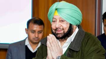 Captain Amarinder Singh congratulates his successor Charanjit Singh Channi