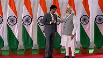 PM Narendra Modi and Noida DM Suhas LY