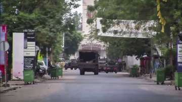 In this image made from video, a military truck is seen near the presidential palace in the capital Conakry, Guinea Sunday
 
 
 
 