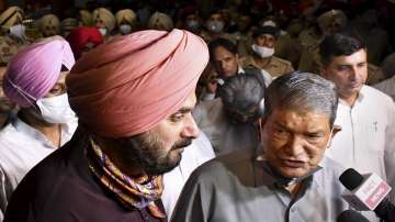 Congress leaders Harish Rawat and Navjot Singh Sidhu brief the media after the CLP Meeting was over at Punjab Bhawan in Chandigarh.