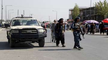 Taliban fighters walk in the city of Kabul, Afghanistan.