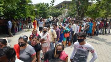 Beneficiaries wait in queues to receive COVID-19 vaccine dose during a Maha Vaccine Campaign by BJP, at Indirapuram Primary School in Ghaziabad.