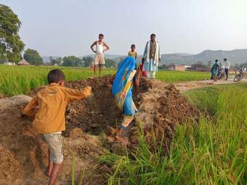 man digs road