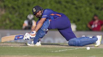 India's Rohit Sharma plays a sweep shot during the Cricket Twenty20 World Cup warm-up match between India and Australia in Dubai, UAE, Wednesday, Oct. 20, 2021.