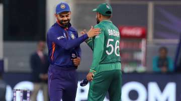 India's captain Virat Kohli (left) and Pakistan's captain Babar Azam greet each other after the toss ahead of the Cricket Twenty20 World Cup match between India and Pakistan in Dubai, UAE, Sunday, Oct. 24, 2021.