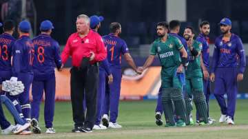 Indian, in blue, and Pakistan's cricketers greet each other at the end of the Cricket Twenty20 World