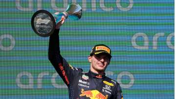 Red Bull driver Max Verstappen holds the trophy after winning the Formula One U.S. Grand Prix at Cir