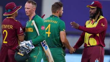 West Indies' Shimron Hetmyer, left, congratulates South Africa's Rassie van der Dussen as West Indie