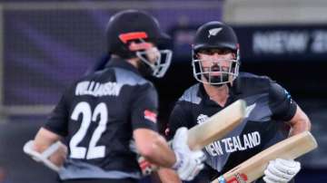 New Zealand's Daryl Mitchell, right, and New captain Kane Williamson run between wickets during the Cricket Twenty20 World Cup match between New Zealand and India in Dubai, UAE, Sunday, Oct. 31, 2021. 