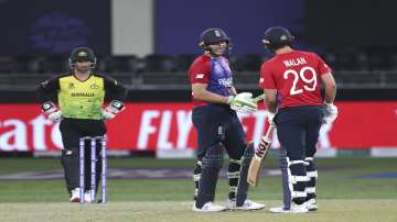 Jos Buttler celebrates his half-century with Dawid Malan during England's T20 World Cup match agains