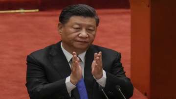 Chinese President Xi Jinping applauds during an event commemorating the 110th anniversary of Xinhai Revolution at the Great Hall of the People in Beijing.
 