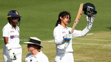 Smriti Mandhana of India celebrates a century during day two of the Women's International Test Match between Australia and India at Metricon Stadium on October 01