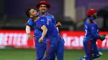 Naveen-ul-Haq of Afghanistan celebrates the wicket of Shoaib Malik of Pakistan during the ICC Men's 