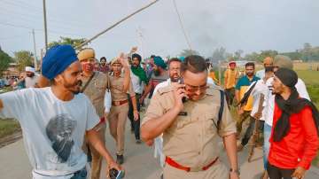 Farmers protest after two of the agitators were allegedly run over by a vehicle in the convoy of a union minister, in Lakhimpur Kheri.