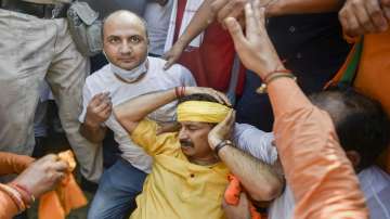 Delhi BJP MP Manoj Tiwari gets hurt during the protest against Delhi CM Arvind Kejriwal in New Delhi, Tuesday.