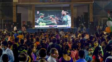 Cricket fans watch the World Cup T20 match of India and Pakistan on a big screen in Kolkata on Oct 24.