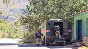 Security personnel near the site of an encounter with militants at the Nar Khas forest area in Poonch.