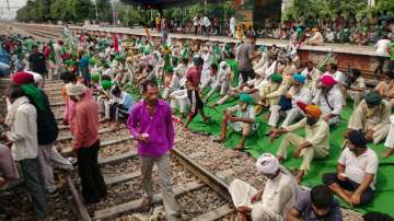 Farmers block the train tracks at a railway station during their Bharat Bandh against central government's three farm reform laws in Bahadurgarh on September 27 (FILE).