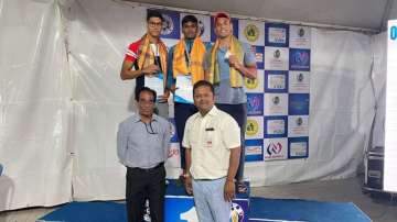Sambhavv R (centre) in the medal ceremony of 50m freestyle for men at the Swimming Nationals in Beng