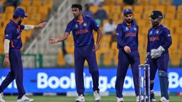 India's Ravichandran Ashwin, without cap, celebrates with teammates after dismissing Afghanistan's Gulbadin Naib during the Cricket Twenty20 World Cup match between India and Afghanistan in Abu Dhabi, UAE, Wednesday, Nov. 3, 2021. 